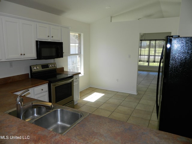 kitchen with white cabinets, a sink, black appliances, and light tile patterned floors