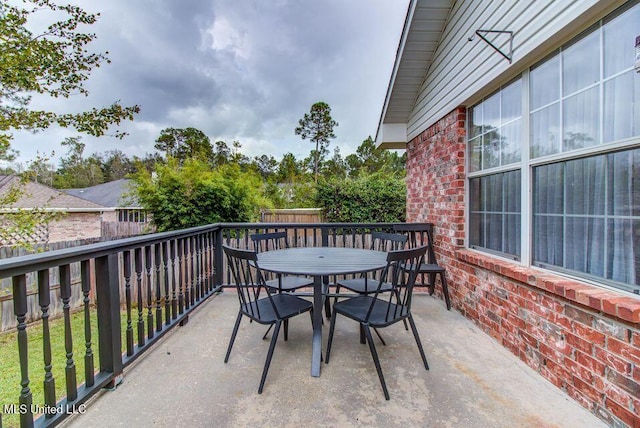 balcony featuring outdoor dining space