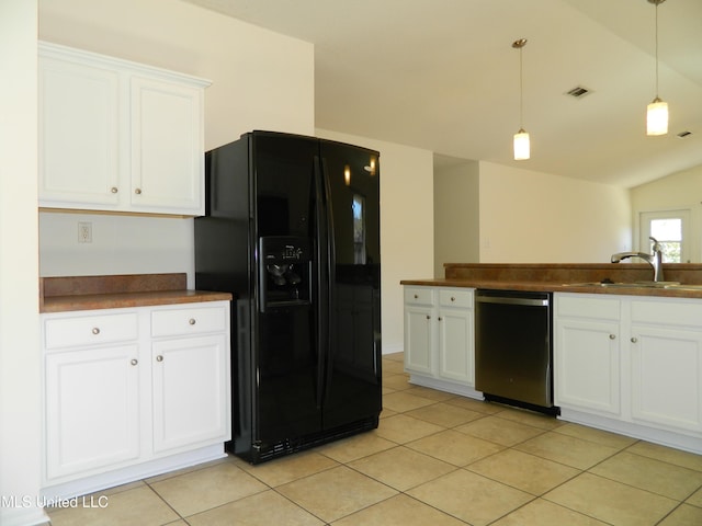 kitchen with visible vents, dishwasher, black fridge with ice dispenser, dark countertops, and a sink