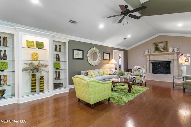 living room with a fireplace, dark hardwood / wood-style flooring, lofted ceiling, ornamental molding, and built in shelves