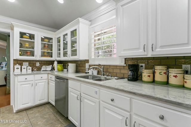 kitchen featuring stainless steel dishwasher, sink, white cabinets, and crown molding