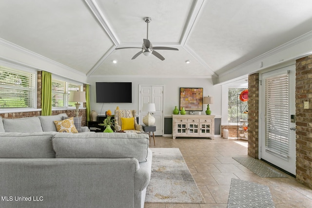 living room featuring crown molding, vaulted ceiling, and ceiling fan