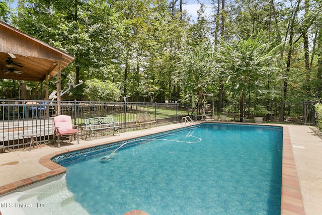 view of pool featuring a patio area and ceiling fan