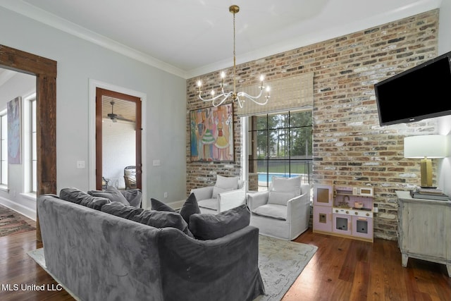 133 Saddlebrook Cv, Madison, MS 39110 - living room with brick wall, a notable chandelier, and wood finished floors