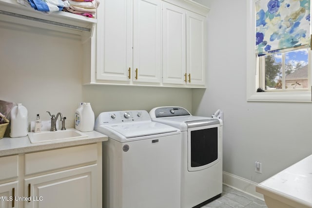 133 Saddlebrook Cv, Madison, MS 39110 - clothes washing area with washing machine and dryer, baseboards, a sink, and cabinet space