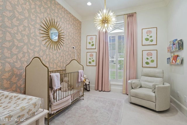 133 Saddlebrook Cv, Madison, MS 39110 - bedroom featuring baseboards, a notable chandelier, wallpapered walls, a crib, and carpet floors