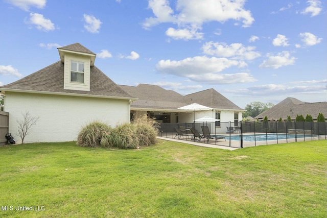 133 Saddlebrook Cv, Madison, MS 39110 - back of house with fence, a lawn, brick siding, and roof with shingles