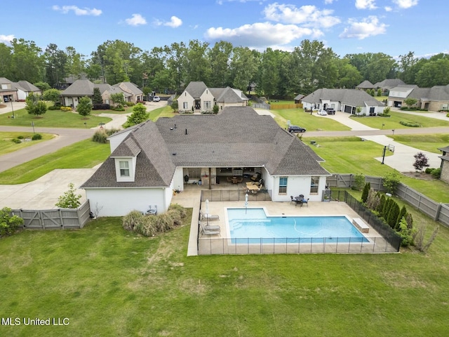 133 Saddlebrook Cv, Madison, MS 39110 - view of swimming pool featuring a residential view, a lawn, and a fenced backyard