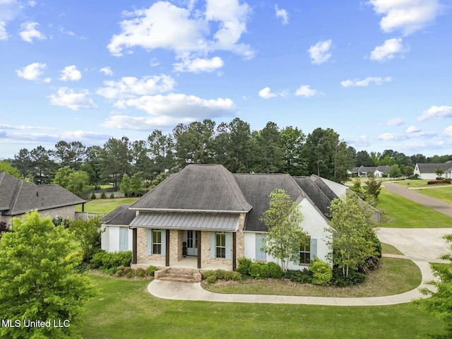 133 Saddlebrook Cv, Madison, MS 39110 - view of front of home featuring a front lawn and covered porch