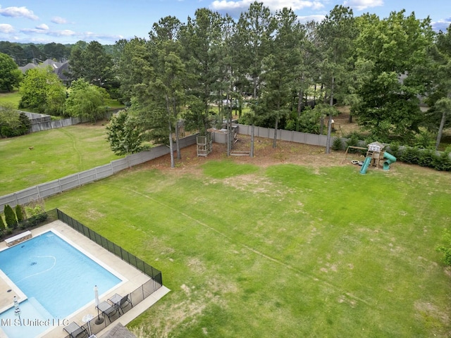 133 Saddlebrook Cv, Madison, MS 39110 - exterior space featuring a playground, a lawn, a fenced backyard, a diving board, and a fenced in pool