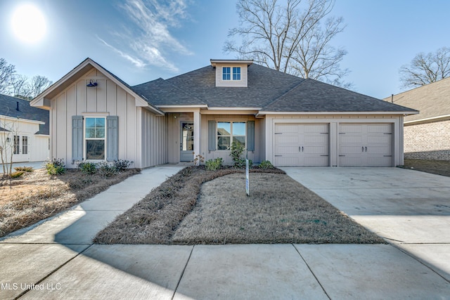 605 Cobalt Way, Brandon, MS 39042 - view of front of property with board and batten siding, concrete driveway, roof with shingles, and a garage