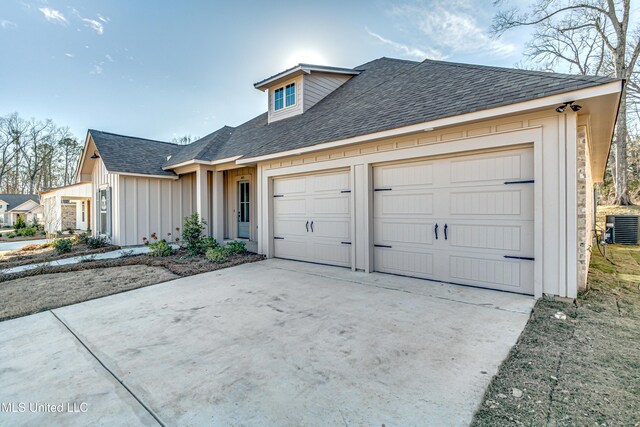 605 Cobalt Way, Brandon, MS 39042 - townhome / multi-family property featuring central AC, concrete driveway, board and batten siding, an attached garage, and roof with shingles