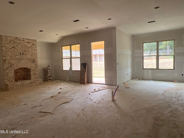 interior space featuring a fireplace and plenty of natural light