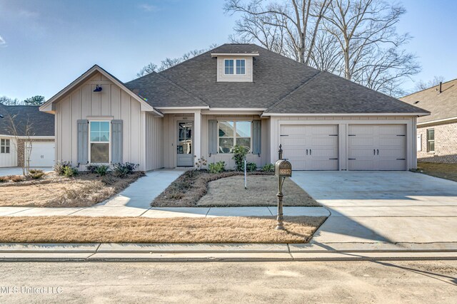 605 Cobalt Way, Brandon, MS 39042 - view of front of home with concrete driveway, roof with shingles, board and batten siding, and a garage