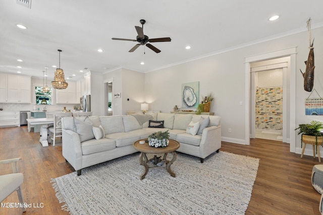 living room featuring ornamental molding, dark hardwood / wood-style floors, and ceiling fan