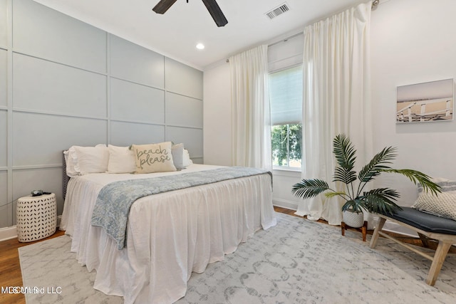 bedroom featuring ceiling fan and light hardwood / wood-style flooring