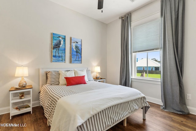 bedroom with ceiling fan and dark hardwood / wood-style flooring