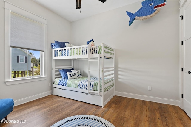 bedroom featuring hardwood / wood-style flooring and ceiling fan