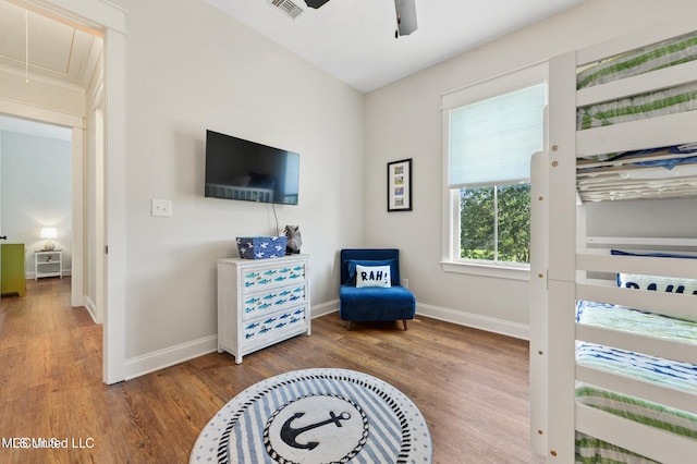 bedroom featuring hardwood / wood-style floors and ceiling fan