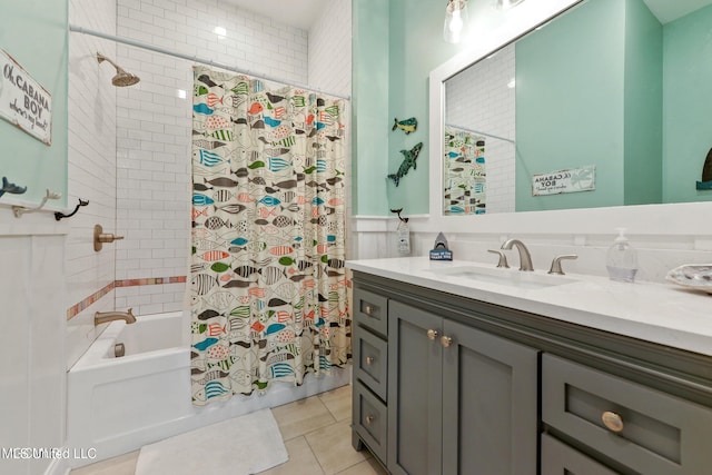 bathroom with tile walls, vanity, tile patterned floors, and shower / bath combination with curtain