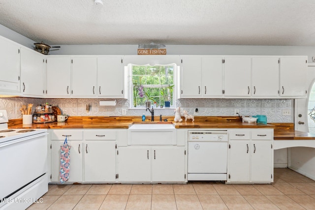 4628 Breland Rd, Vancleave, MS 39565 - kitchen with white appliances, extractor fan, backsplash, white cabinetry, and a textured ceiling