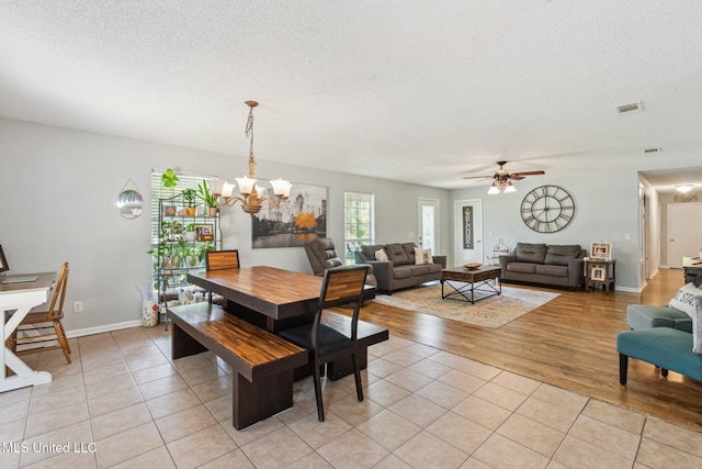 4628 Breland Rd, Vancleave, MS 39565 - dining room featuring light tile patterned floors, a textured ceiling, a chandelier, ceiling fan, and baseboards