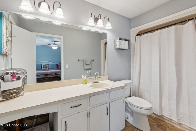 4628 Breland Rd, Vancleave, MS 39565 - ensuite bathroom with vanity, toilet, and ceiling fan
