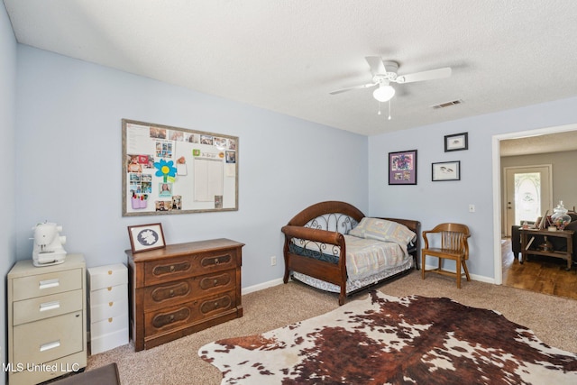 4628 Breland Rd, Vancleave, MS 39565 - carpeted bedroom featuring ceiling fan, baseboards, and a textured ceiling