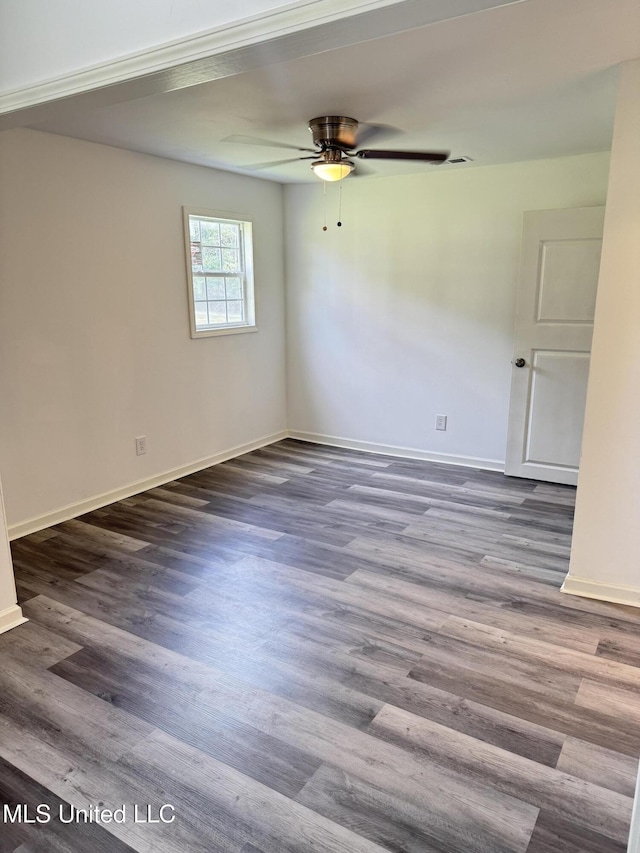 100 Warren St, Como, MS 38619 - unfurnished room with a ceiling fan, baseboards, and wood finished floors