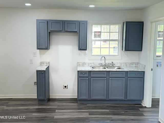 100 Warren St, Como, MS 38619 - kitchen with a sink, dark wood-type flooring, baseboards, and recessed lighting