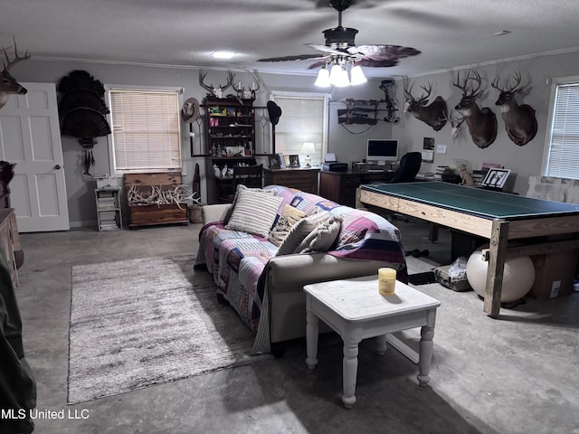 1202 Hemingway St, Greenwood, MS 38930 - interior space with unfinished concrete flooring, ornamental molding, and ceiling fan