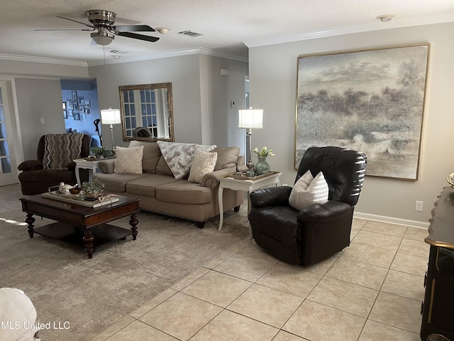1202 Hemingway St, Greenwood, MS 38930 - living area featuring visible vents, ceiling fan, ornamental molding, and light tile patterned floors
