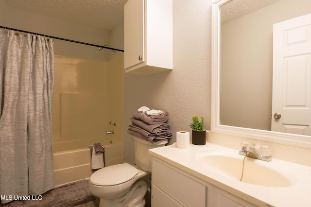 full bathroom featuring vanity, shower / bath combination with curtain, a textured ceiling, and toilet