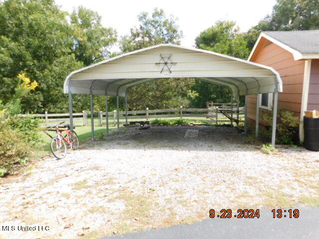 view of car parking with a carport