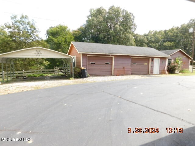 garage with a carport