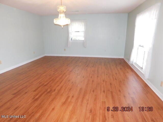 spare room featuring hardwood / wood-style floors