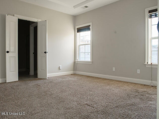 view of carpeted spare room