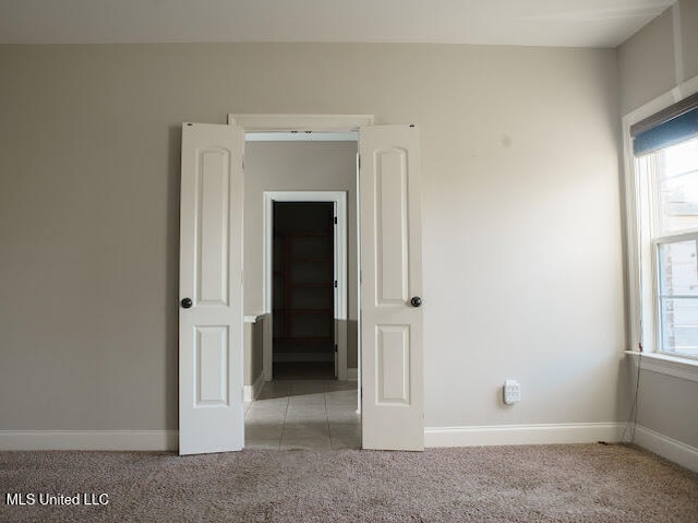 empty room featuring light carpet