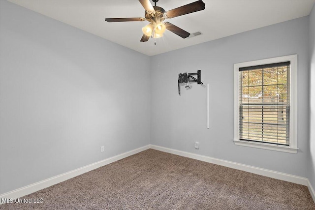 unfurnished room with ceiling fan and carpet floors