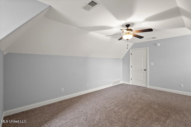 additional living space featuring carpet, vaulted ceiling, and ceiling fan