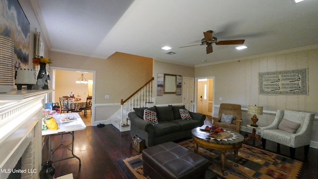 living room featuring crown molding, ceiling fan with notable chandelier, and dark hardwood / wood-style flooring