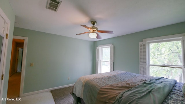 carpeted bedroom with ceiling fan