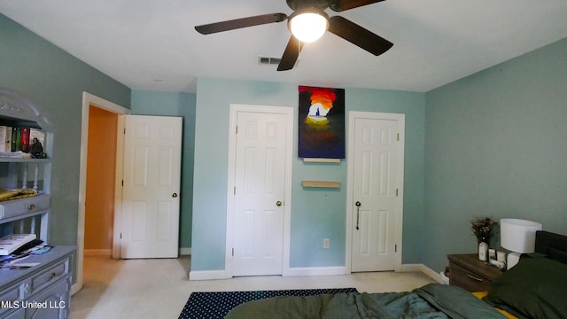 carpeted bedroom featuring ceiling fan