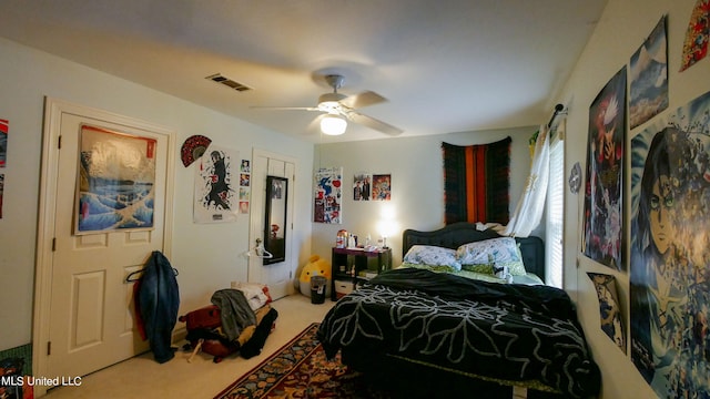 carpeted bedroom with ceiling fan