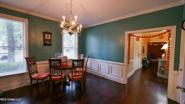 dining area featuring an inviting chandelier, crown molding, and dark hardwood / wood-style floors