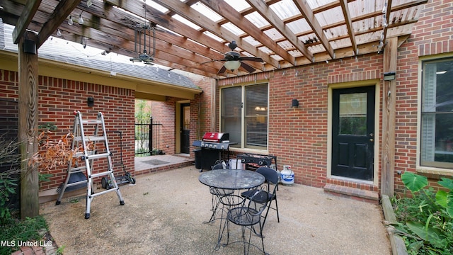 view of patio / terrace with area for grilling, a pergola, and ceiling fan