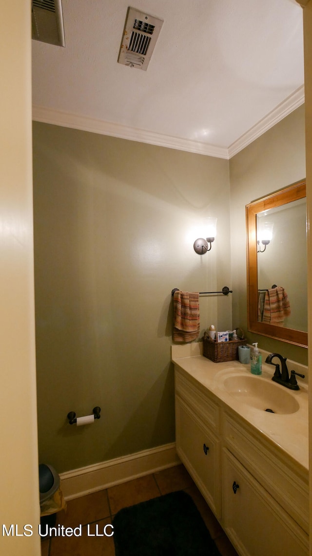 bathroom with vanity, crown molding, and tile patterned floors