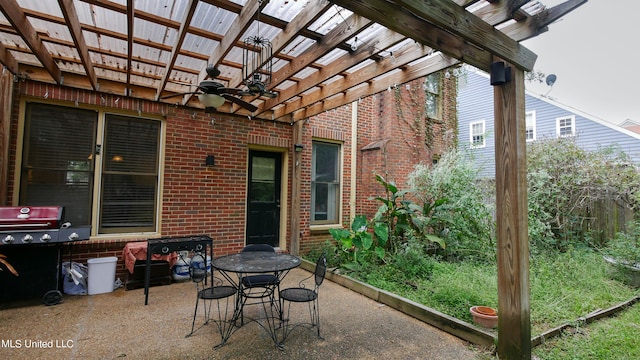 view of patio with ceiling fan and a pergola