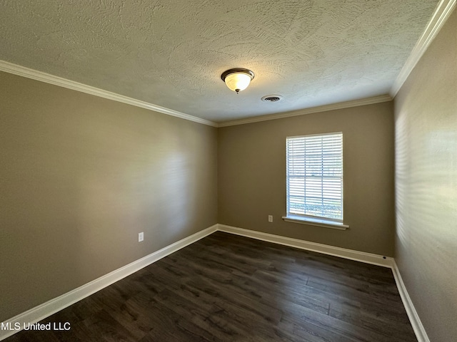 spare room featuring dark hardwood / wood-style floors, ornamental molding, and a textured ceiling