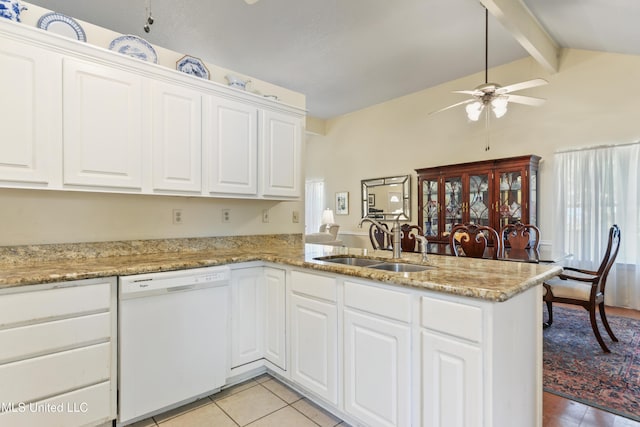 6658 Ahekolo Cir, Diamondhead, MS 39525 - kitchen featuring white dishwasher, a peninsula, a ceiling fan, and light tile patterned flooring
